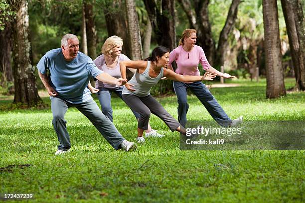 tai chi class - woman and tai chi stock pictures, royalty-free photos & images