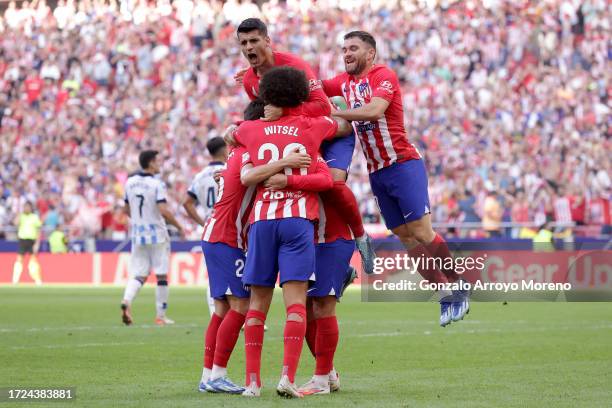 Antoine Griezmann of Atletico Madrid celebrates with teammtes after scoring the team's second goal from a penalty during the LaLiga EA Sports match...