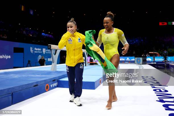 Flavia Saraiva and Rebeca Andrade of Team Brazil celebrate after finishing third and second on the Floor Exercise in the Women's Apparatus Finals on...