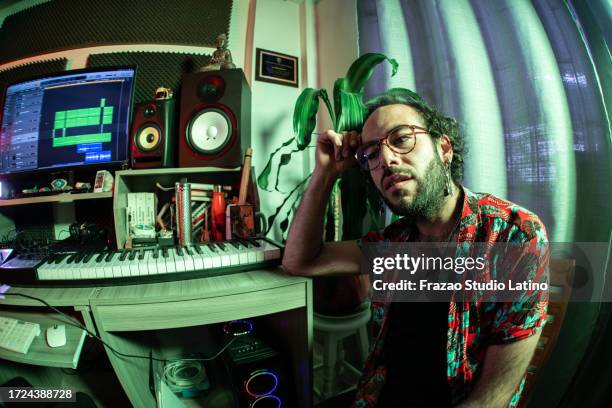 portrait of a music producer at music studio - dj portrait stock pictures, royalty-free photos & images