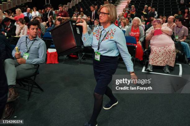 Party members take part in voting on day one of the Labour Party conference on October 08, 2023 in Liverpool, England. The Labour Party go into their...