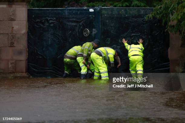 Workers put in place flood defences in the North Inch area on October 08, 2023 in Perth, Scotland. The Scottish Environment Protection Agency says...