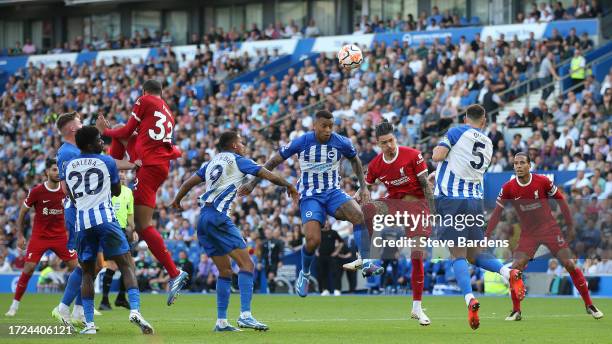 Darwin Nunez of Liverpool battles for possession with Igor Julio of Brighton & Hove Albion during the Premier League match between Brighton & Hove...