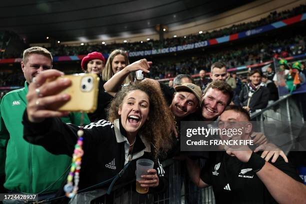 New Zealand's loosehead prop Ethan de Groot poses for selfie photos after winning the France 2023 Rugby World Cup quarter-final match between Ireland...