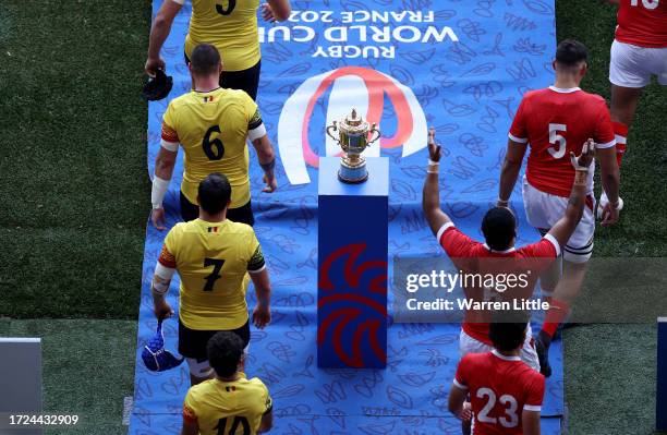 The players of both teams walk past the The Webb Ellis Cup as they take to the field prior to the Rugby World Cup France 2023 match between Tonga and...