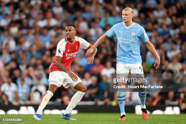 Gabriel of Arsenal holds off Erling Haaland of Manchester City during the Premier League match between Arsenal FC and Manchester City at Emirates...