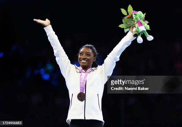 Gold Medalist Simone Biles of USA poses for photographs on the podium for the Women's Floor Final during Day Nine of the 2023 Artistic Gymnastics...