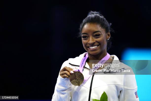 Simone Biles of United States Gold Medal, celebrates on the podium of Floor exercise Women's Apparatus Finals on Day Nine of the 2023 Artistic...