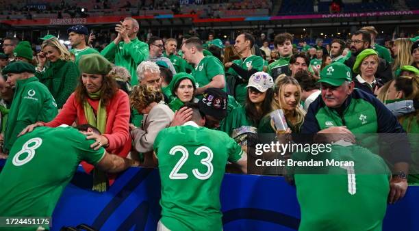 Paris , France - 14 October 2023; Ireland players, from left, Caelan Doris, Jimmy O'Brien and Andrew Porter are consoled by family members after...