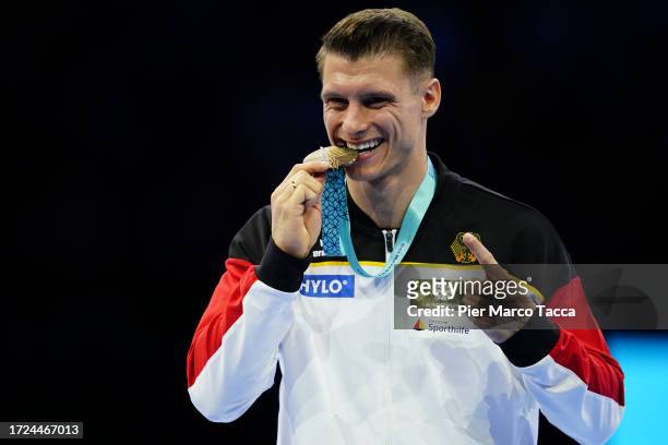 Lukas Dauser of Germany Golden Medal celebrates on the podium for the Men's Parallel Bars Final on Day Nine of the 2023 Artistic Gymnastics World...
