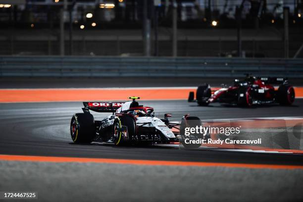 Yuki Tsunoda of Japan driving the Scuderia AlphaTauri AT04 leads Valtteri Bottas of Finland driving the Alfa Romeo F1 C43 Ferrari during the F1 Grand...