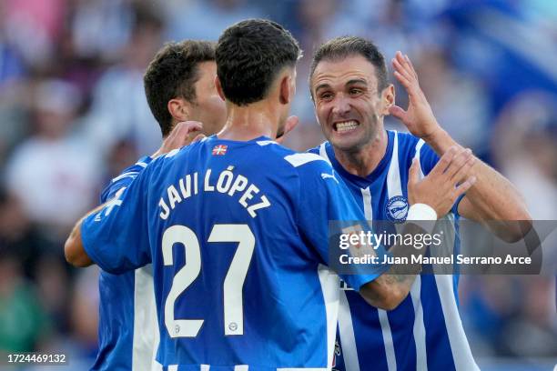 Kike and team mates of Deportivo Alaves celebrate after Hector Bellerin of Real Betis scores their sides own goal during the LaLiga EA Sports match...