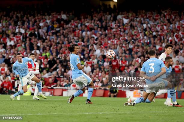Gabriel Martinelli of Arsenal scores their sides first goal during the Premier League match between Arsenal FC and Manchester City at Emirates...