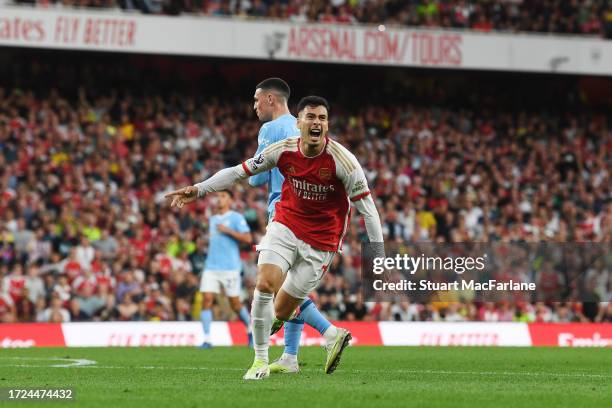 Gabriel Martinelli of Arsenal celebrates after scoring their sides first goal during the Premier League match between Arsenal FC and Manchester City...