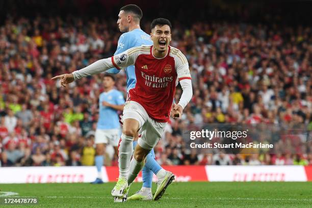 Gabriel Martinelli of Arsenal celebrates after scoring their sides first goal during the Premier League match between Arsenal FC and Manchester City...