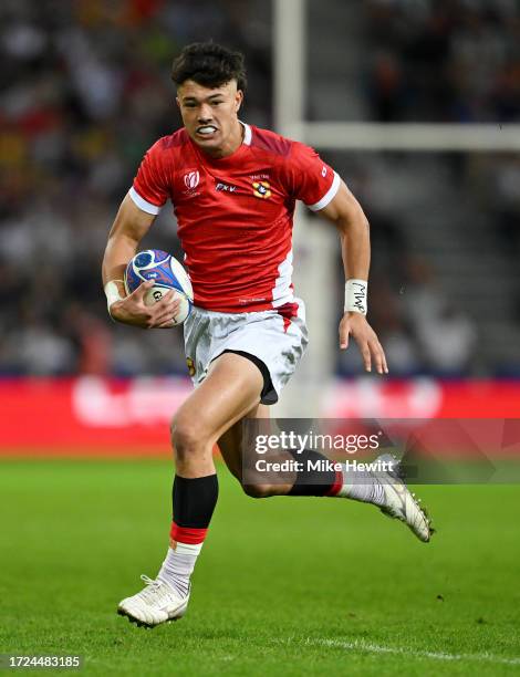 Kyren Taumoefolau of Tonga breaks with the ball to score his team's seventh try during the Rugby World Cup France 2023 match between Tonga and...