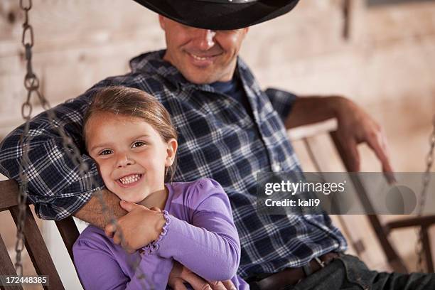 little girl with daddy - country western outside stockfoto's en -beelden