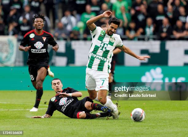 Brandon Domingues of DVSC fouls Mohamed Ali Ben Romdhane of Ferencvarosi TC during the Hungarian OTP Bank Liga match between Ferencvarosi TC and DVSC...