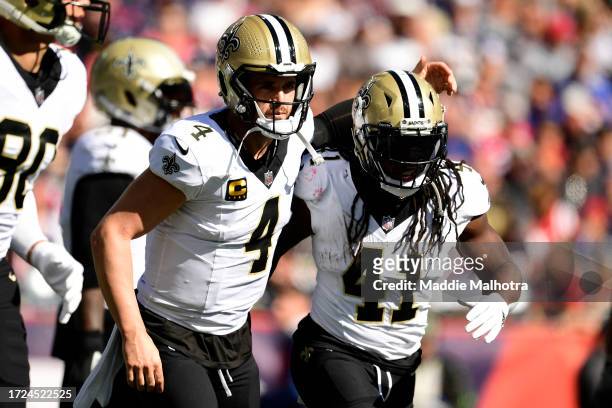 Derek Carr of the New Orleans Saints and Alvin Kamara of the New Orleans Saints celebrate after Kamara's rushing touchdown during the second quarter...