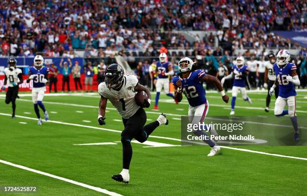 Travis Etienne Jr. #1 of the Jacksonville Jaguars runs to score a touchdown in the Fourth Quarter during the NFL Match between Jacksonville Jaguars...