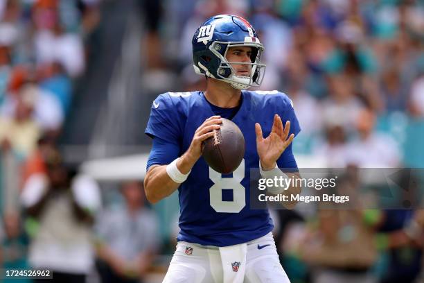 Daniel Jones of the New York Giants looks to pass against the Miami Dolphins during the first quarter at Hard Rock Stadium on October 08, 2023 in...