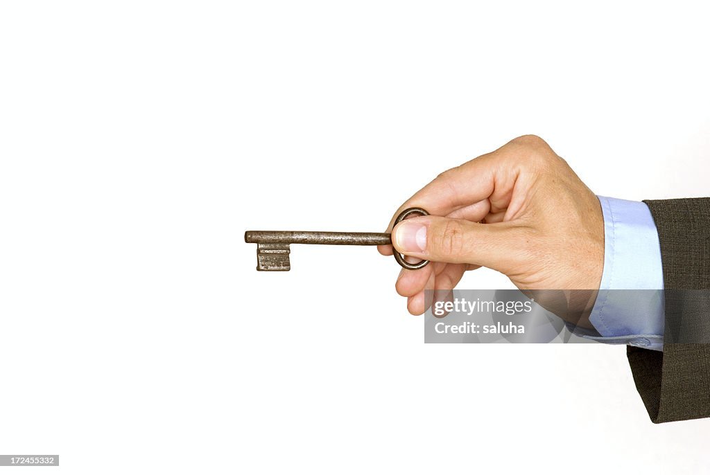 Male holding door key