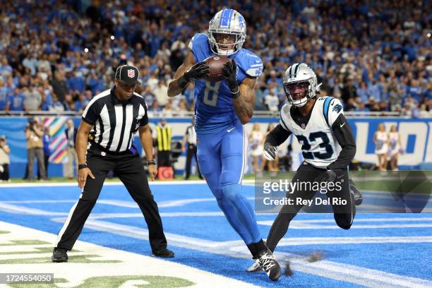 Josh Reynolds of the Detroit Lions makes a catch for a touchdown past CJ Henderson of the Carolina Panthers in the second quarter at Ford Field on...