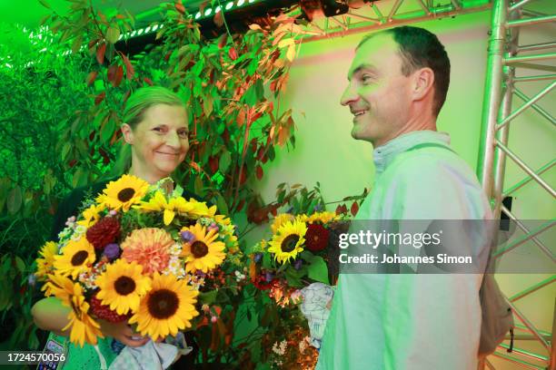 Supporters of the Green Party react to initial results in Bavarian state elections following the closing of polling stations on October 8, 2023 in...