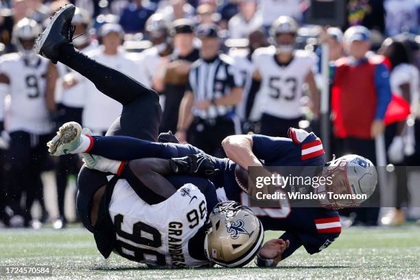 Carl Granderson of the New Orleans Saints sacks Mac Jones of the New England Patriots during the second quarter at Gillette Stadium on October 08,...