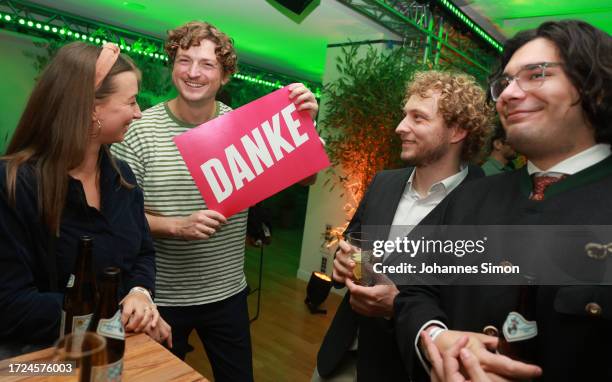 Supporters of the Green Party react to initial results in Bavarian state elections following the closing of polling stations on October 8, 2023 in...