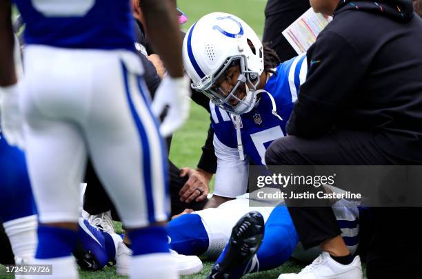 Anthony Richardson of the Indianapolis Colts reacts after an injury during the play against the Tennessee Titans during the second quarter at Lucas...