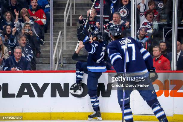 Mason Appleton and Adam Lowry of the Winnipeg Jets celebrate a third period short-handed goal against the Florida Panthers at the Canada Life Centre...