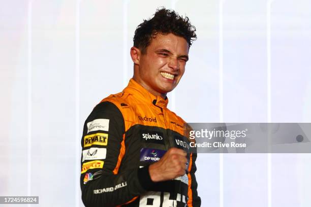Third placed Lando Norris of Great Britain and McLaren celebrates on the podium during the F1 Grand Prix of Qatar at Lusail International Circuit on...