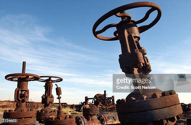 An oil collection facility lies at ruins in the giant Burgan oil field January 13, 2003 in Central Kuwait. The oil field, the largest in the world,...