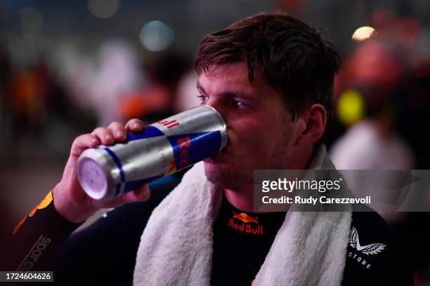 Race winner Max Verstappen of the Netherlands and Oracle Red Bull Racing takes a drink in parc ferme during the F1 Grand Prix of Qatar at Lusail...