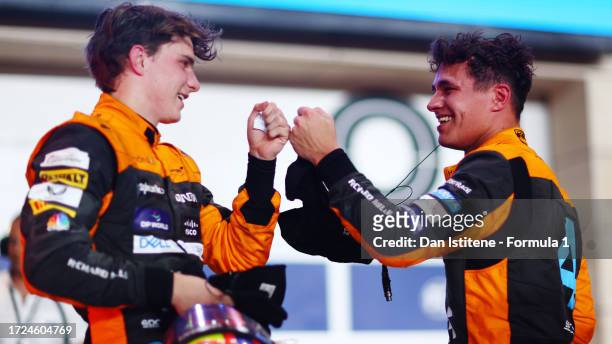 Second placed Oscar Piastri of Australia and McLaren and Third placed Lando Norris of Great Britain and McLaren celebrate in parc ferme during the F1...