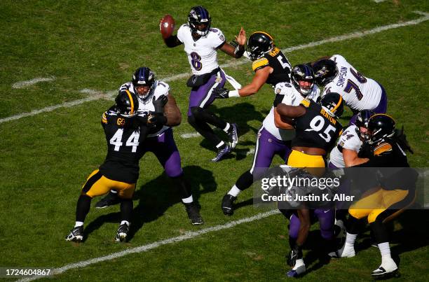 Alex Highsmith of the Pittsburgh Steelers sacks Lamar Jackson of the Baltimore Ravens during the third quarter at Acrisure Stadium on October 08,...