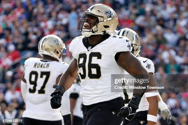 Carl Granderson of the New Orleans Saints celebrates after a tackle for a loss during the third quarter against the New England Patriots at Gillette...