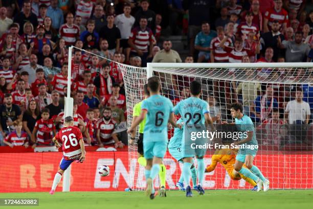 Bryan Zaragoza of Granada CF shoots for score their second side goal during the LaLiga EA Sports match between Granada CF and FC Barcelona at Estadio...