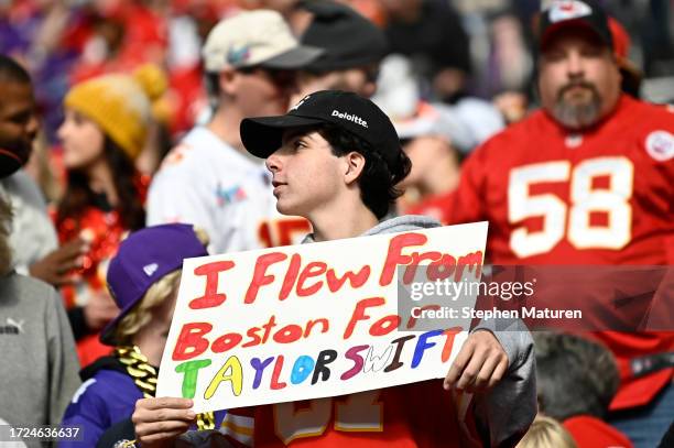 Kansas City Chiefs fan holds up a sign in reference to Taylor Swift prior to a game against the Minnesota Vikings at U.S. Bank Stadium on October 08,...