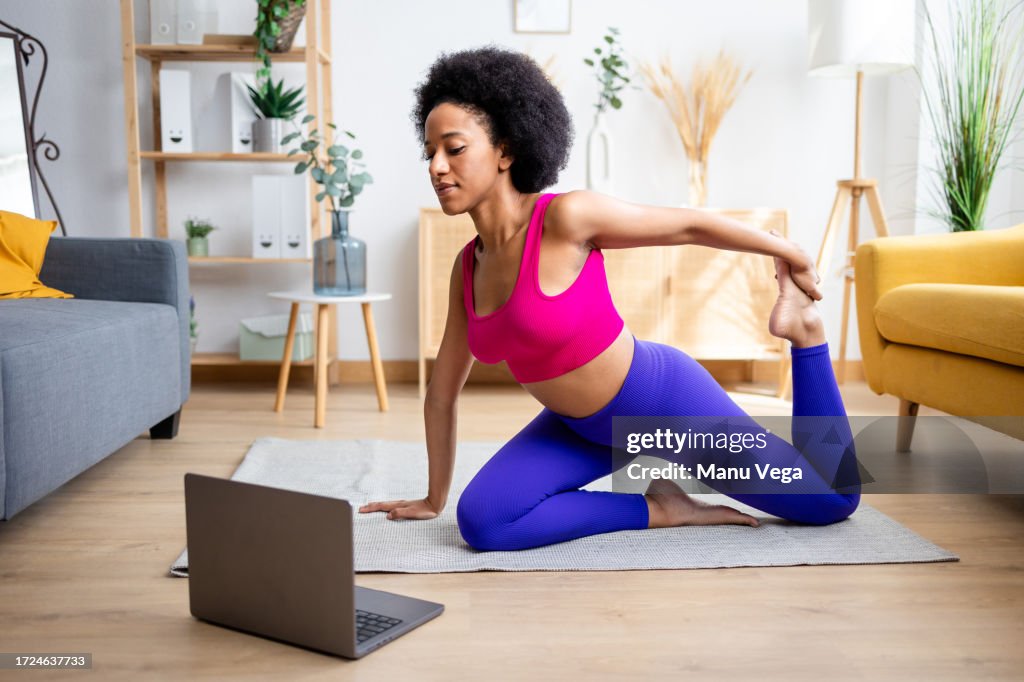 Black woman doing yoga exercise