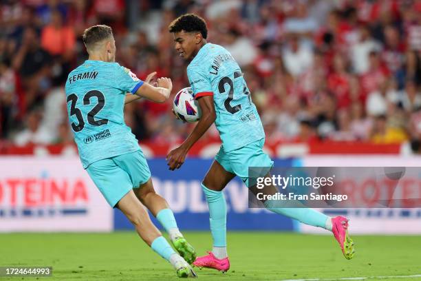 Lamine Yamal of FC Barcelona celebrates after scoring their first side goal during the LaLiga EA Sports match between Granada CF and FC Barcelona at...