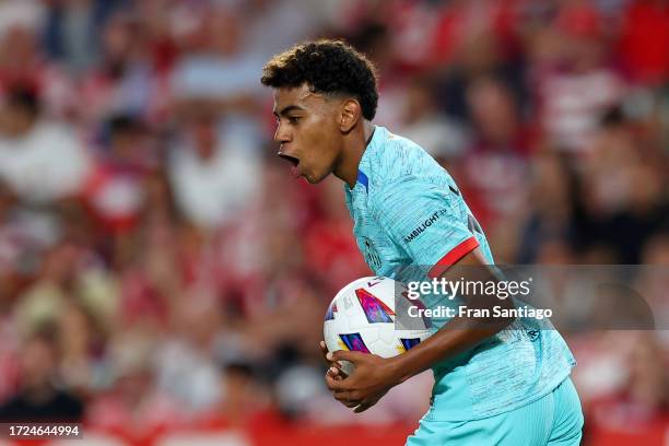 Lamine Yamal of FC Barcelona celebrates after scoring their first side goal during the LaLiga EA Sports match between Granada CF and FC Barcelona at...