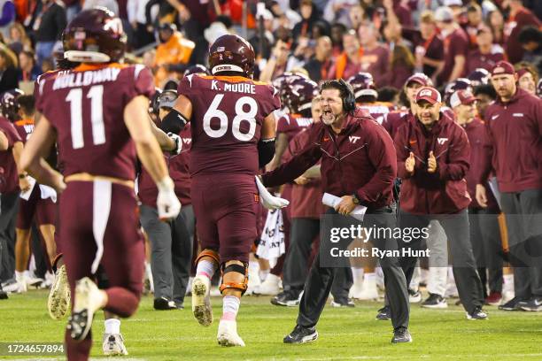 Head coach Brent Pry of the Virginia Tech Hokies reacts after a touchdown against the Wake Forest Demon Deacons in the second half during a game at...