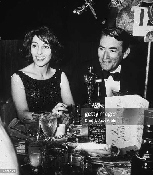 American actor Gregory Peck and his wife, Veronique, sit together at the Academy Awards after party, Santa Monica, California, April 8, 1963. Peck...