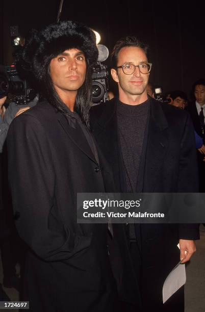American fashion photographers Steven Meisel pose together, c. 1990.