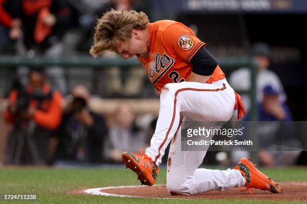 Gunnar Henderson of the Baltimore Orioles celebrates his score at home plate against the Texas Rangers during the first inning in Game Two of the...