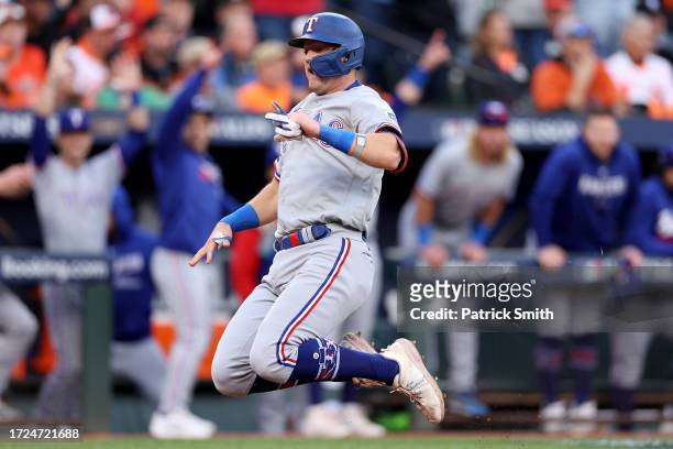 Josh Jung of the Texas Rangers scores a run after a two-run RBI double by Leody Taveras during the second inning against the Baltimore Orioles in...