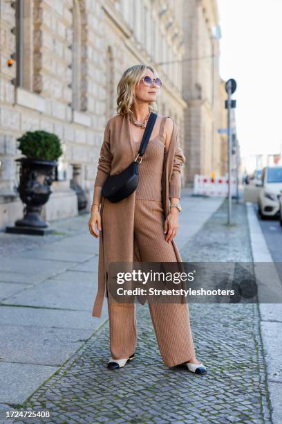 Influencer Tamara von Nayhauss, wearing balarinas by Chanel, a beige knittet coat, top and pants by The Mercer, a chain by Zara, a black bag by Le...