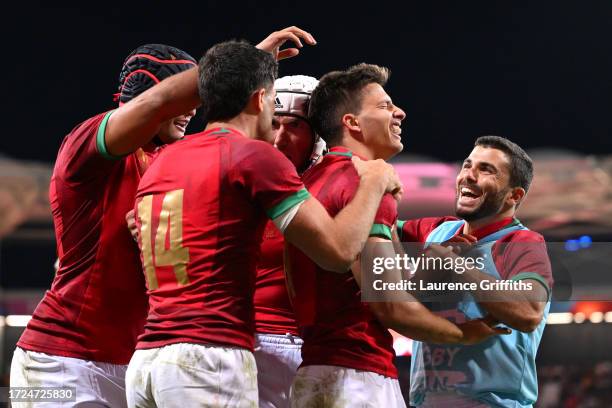 Rodrigo Marta of Portugal celebrates with teammates after scoring his team's third try during the Rugby World Cup France 2023 match between Fiji and...